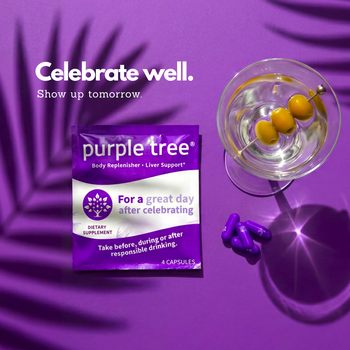 Purple Tree body replenisher and liver support dietary supplement, shown as a purple packet next to a glass of martini with olives and loose purple capsules on a purple background with palm shadows.